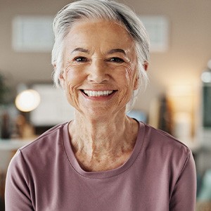 Closeup of senior woman smiling at home